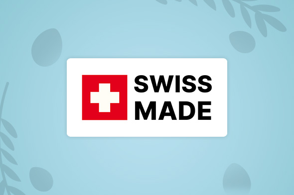 Swiss made skilt p&aring; en p&aring;ske baggrund